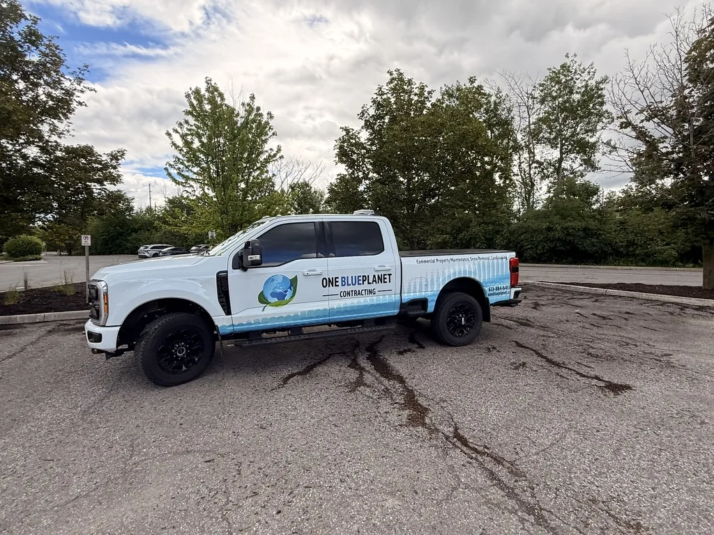 Branded OneBluePlanet commercial property maintenance service truck