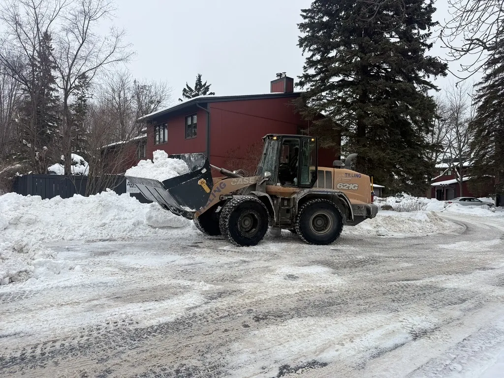 Case 621 loader carrying snow during winter operations