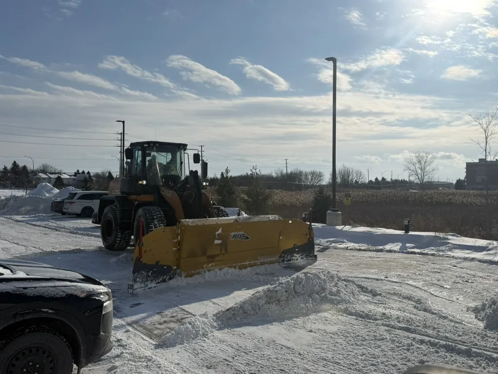 Case 621 wheel loader equipped with a Metal Pless plow at an Ottawa commercial property